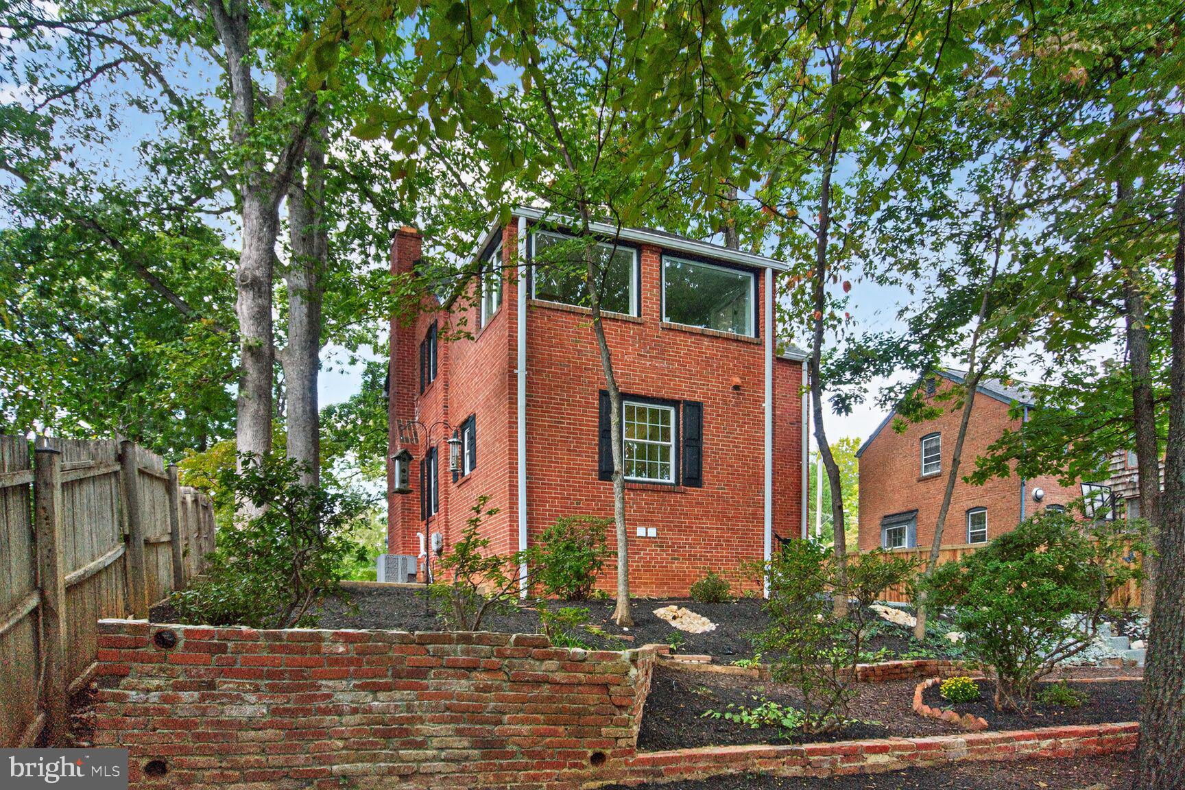 302 Penwood Road Silver Spring, MD 20901 - Photo 7 of 44 two house that has a tree in front of the house