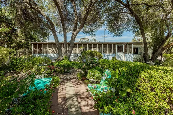 front view of a house with a garden