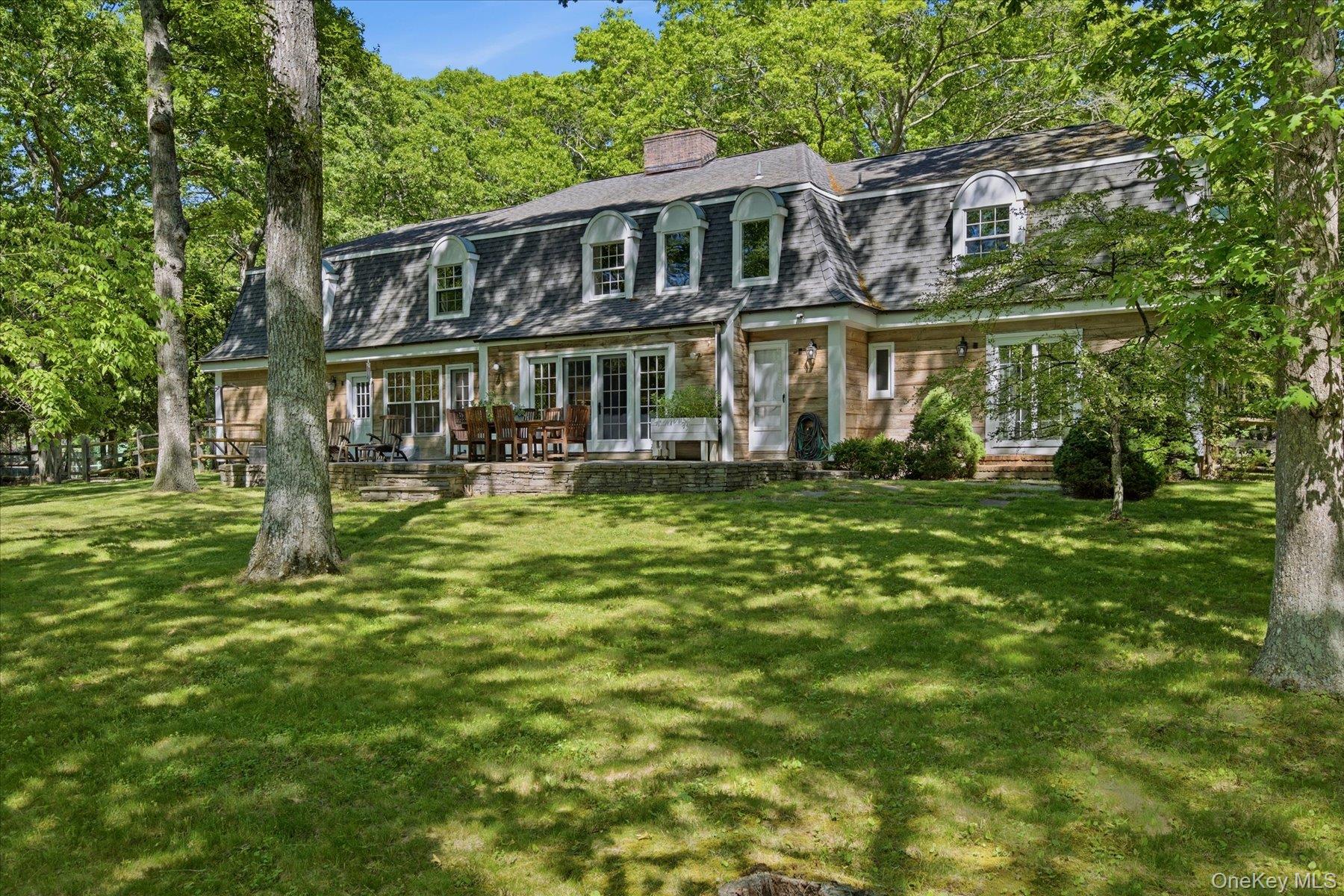44 Georgica Close Road East Hampton, NY 11937 - Photo 11 of 28 a front view of a house with a yard