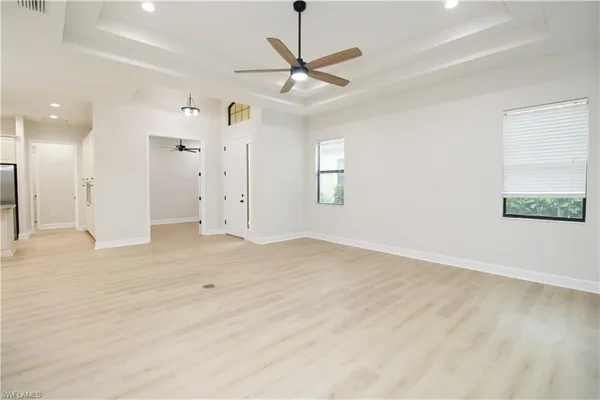 a view of a livingroom with a ceiling fan and window