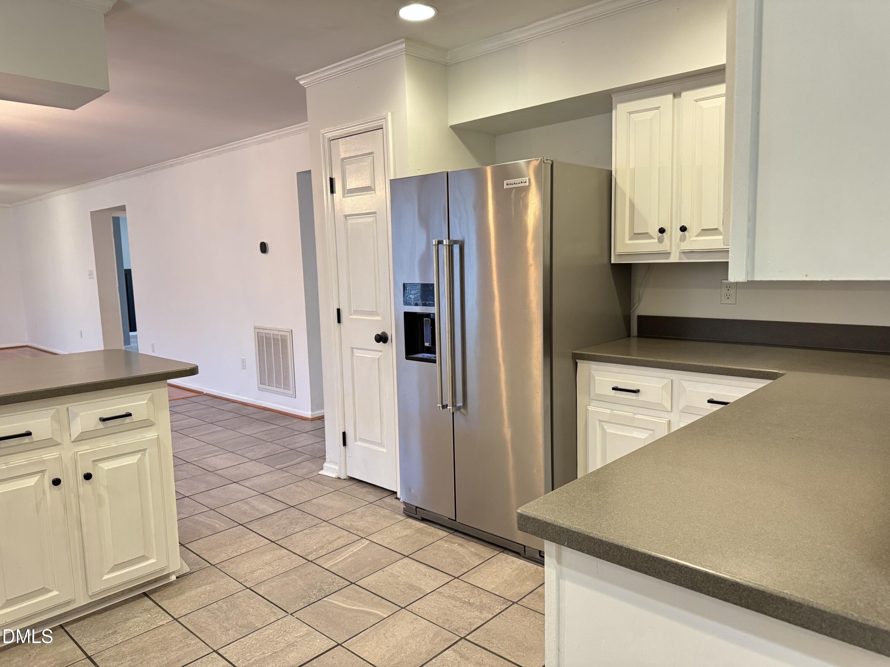 4632 Culbreth Road Oxford, NC 27565 - Photo 11 of 20 a kitchen with stainless steel appliances a refrigerator and a stove