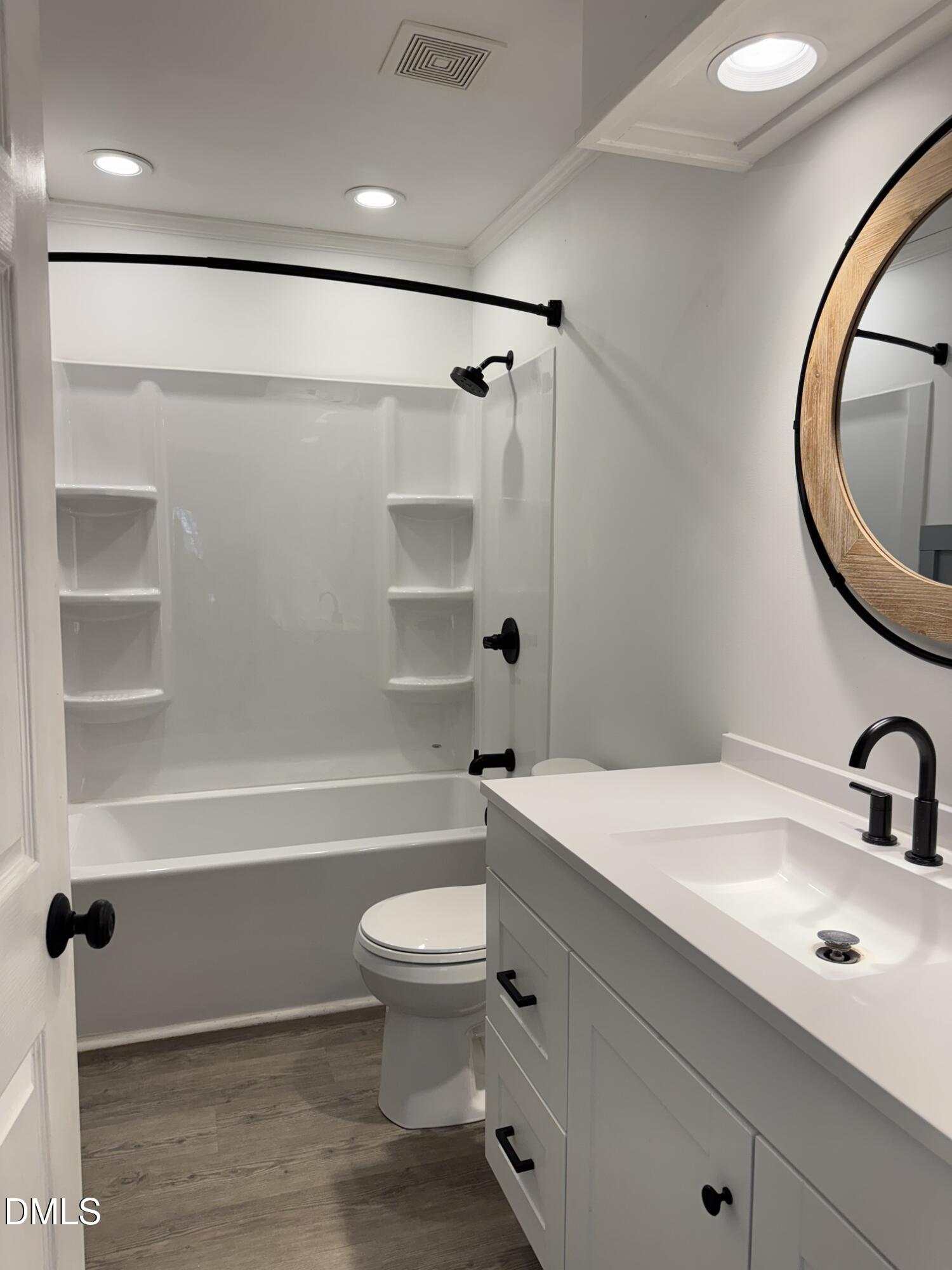 4632 Culbreth Road Oxford, NC 27565 - Photo 17 of 20 a bathroom with a sink a toilet and a bathtub