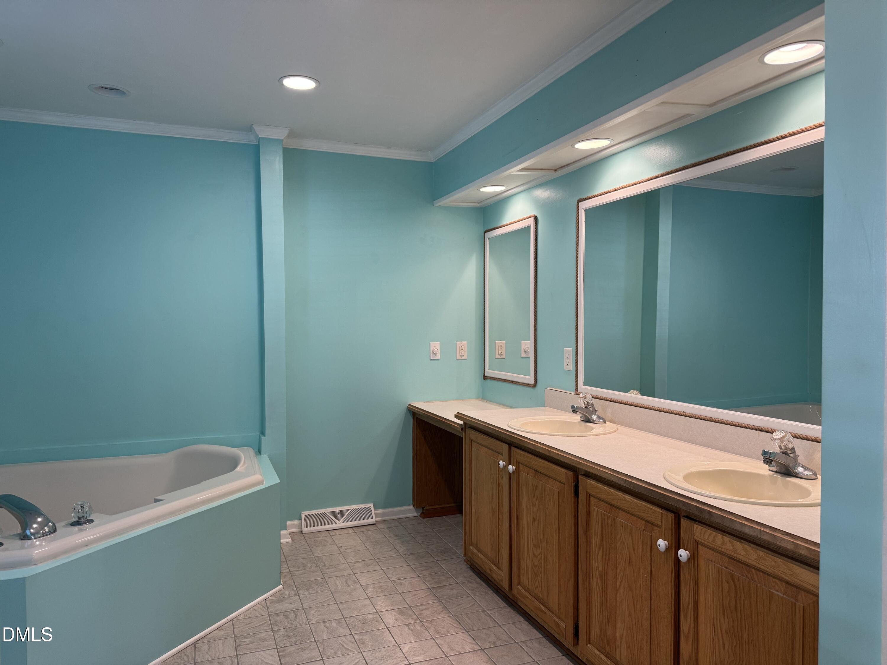 4632 Culbreth Road Oxford, NC 27565 - Photo 19 of 20 a bathroom with a bathtub and a sink