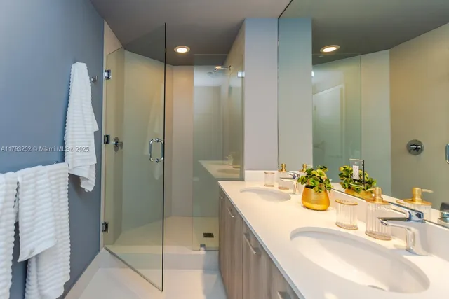 a view of a balcony with a floor to ceiling window next to a yard