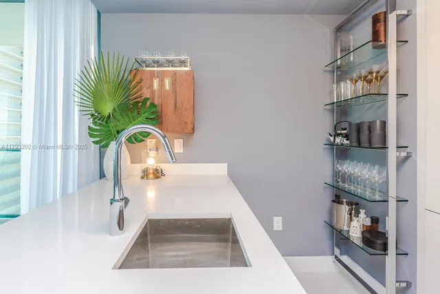 a kitchen with a refrigerator and a more cabinets