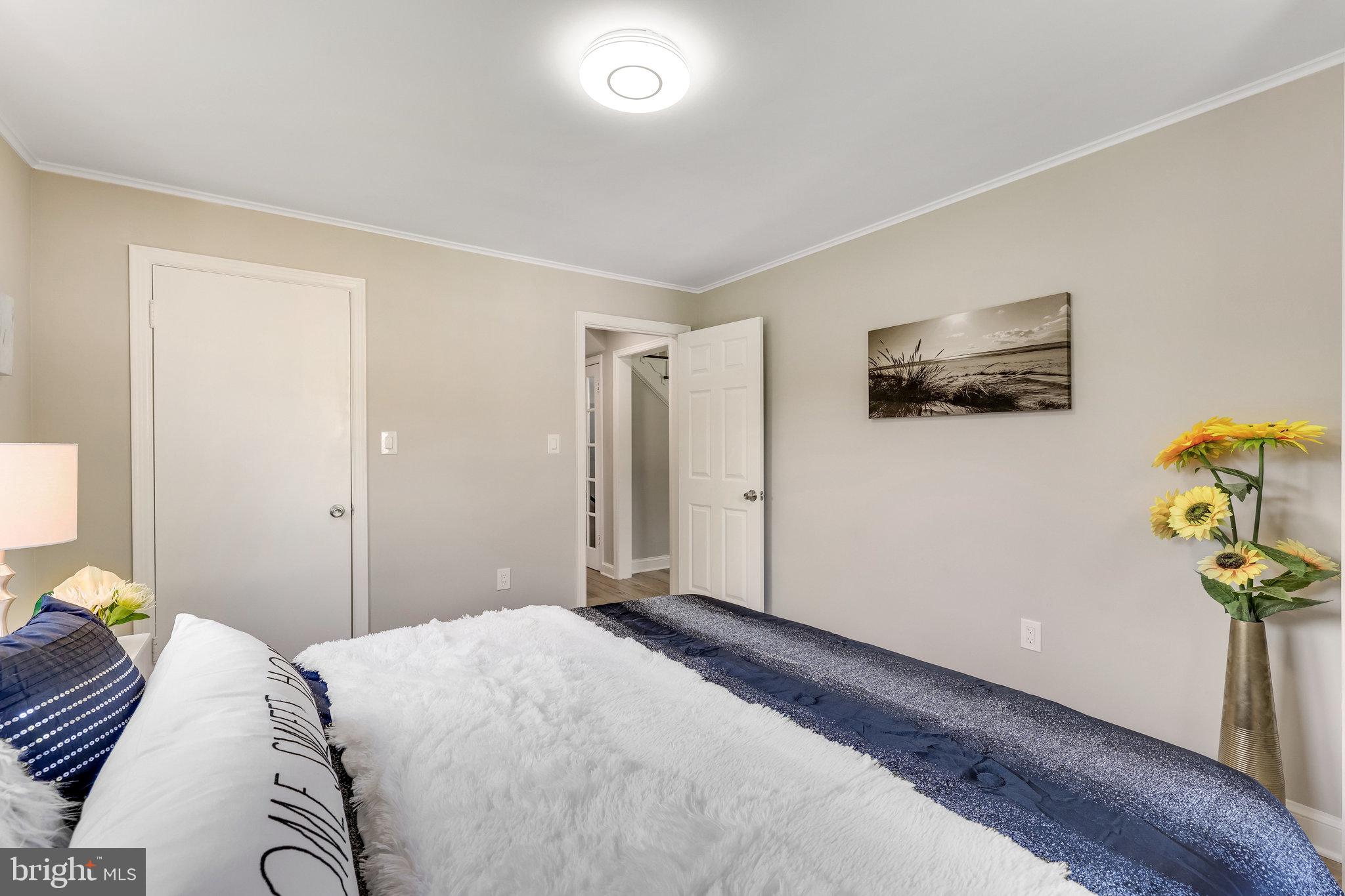 11410 Waples Mill Road Oakton, VA 22124 - Photo 28 of 62 Serene bedroom with modern touches.