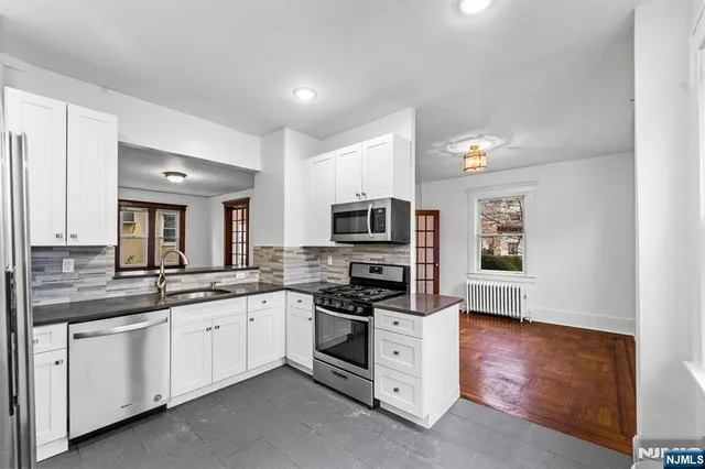 a large kitchen with cabinets