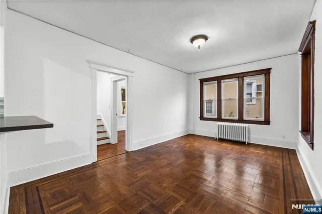 a view of an empty room with glass door
