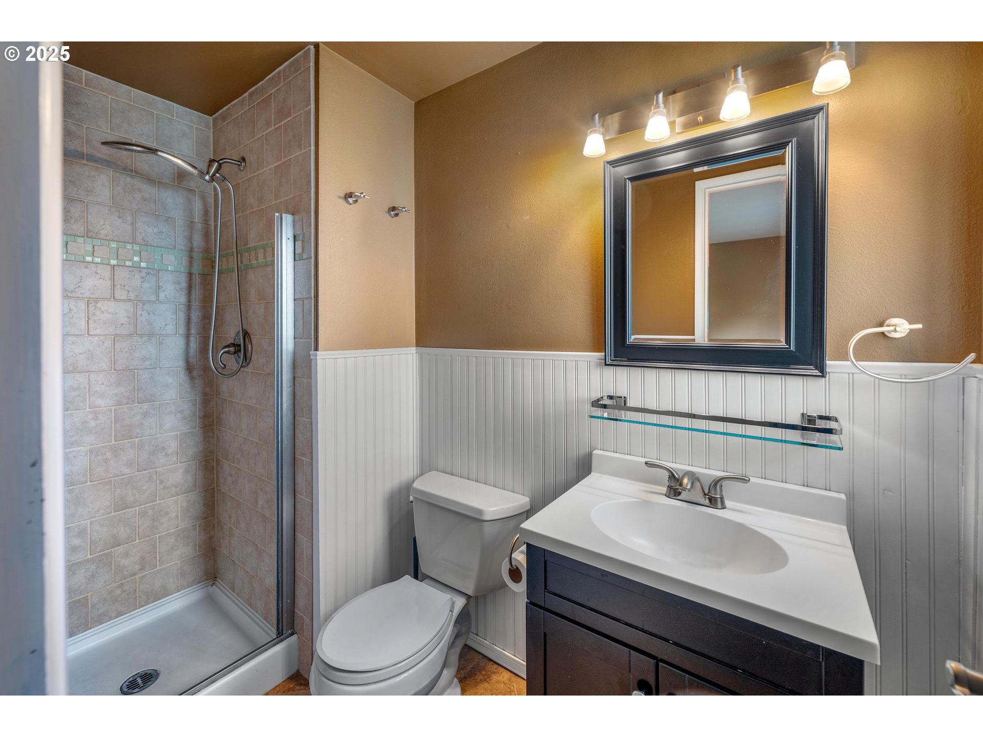 18115 Southwest Broad Oak Boulevard Beaverton, OR 97007 - Photo 21 of 43 a bathroom with a sink a toilet a mirror and shower