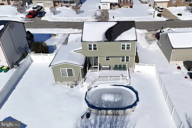 an aerial view of a house with outdoor space