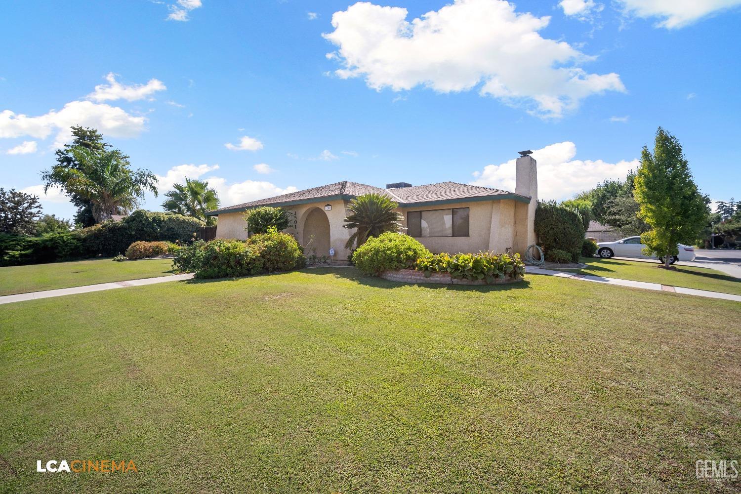 Undisclosed Address Bakersfield, CA 93309 - Photo 1 of 22 a view of a house with a yard and potted plants