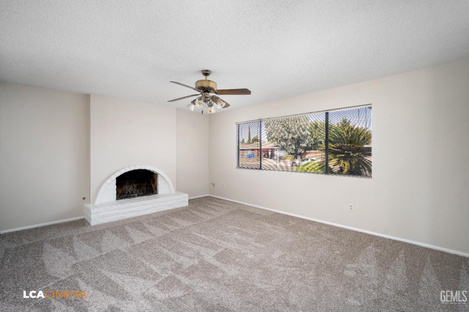 Undisclosed Address Bakersfield, CA 93309 - Photo 11 of 22 a view of an empty room with a window