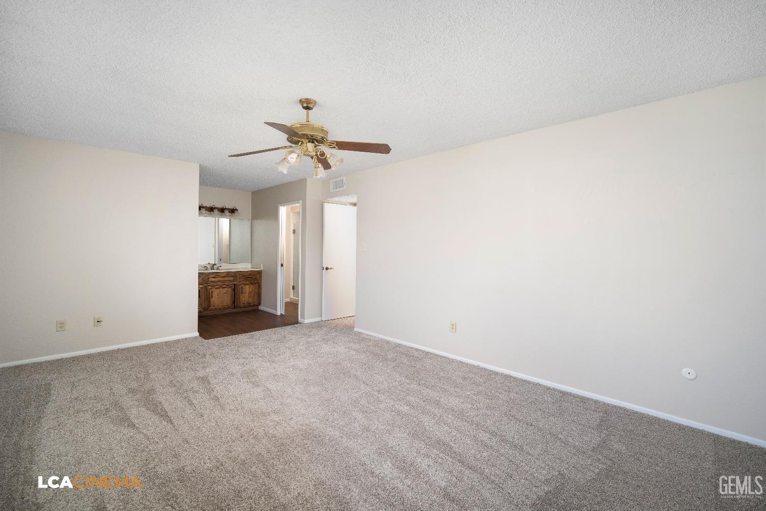 Undisclosed Address Bakersfield, CA 93309 - Photo 17 of 22 a view of an empty room with a ceiling fan