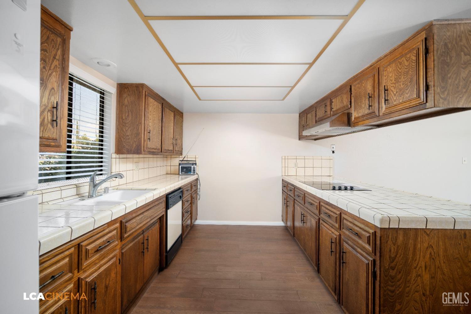 Undisclosed Address Bakersfield, CA 93309 - Photo 7 of 22 a kitchen with stainless steel appliances granite countertop a sink and a stove