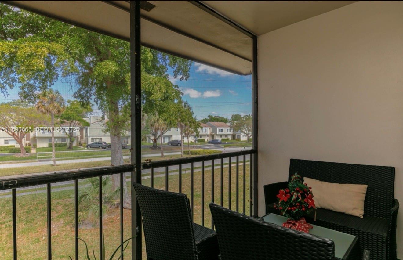 8060 North Colony Circle, Unit 207 Tamarac, FL 33321 - Photo 11 of 14 a view of city from a balcony