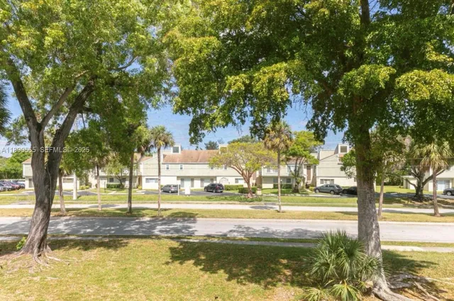 a view of a swimming pool with an outdoor seating and a garden