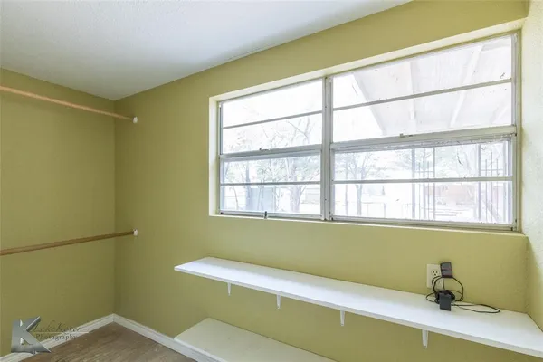 a bathroom with a bathtub and window