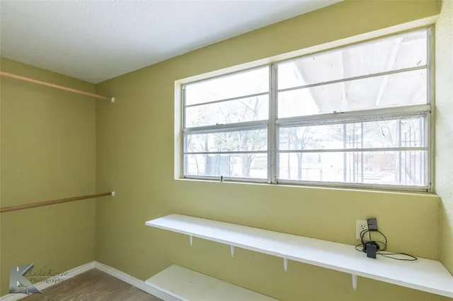 a bathroom with a bathtub and window