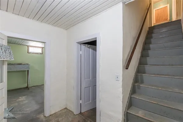 a view of entryway with stairs and a window
