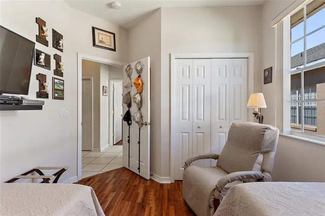 a bedroom with a bed and a lamp on table