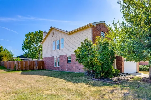 a backyard of a house with lots of green space