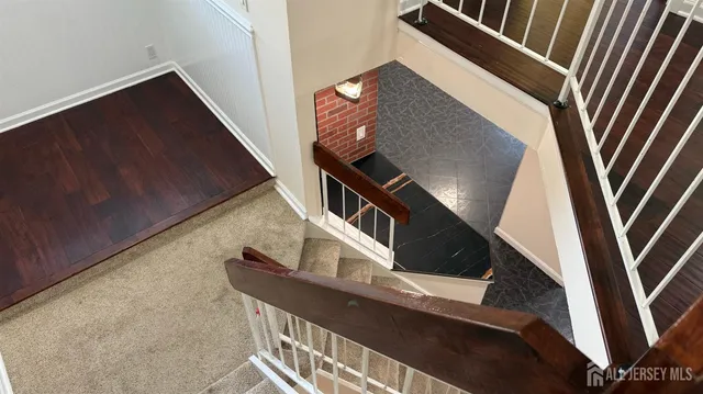 a living room with furniture and a ceiling fan