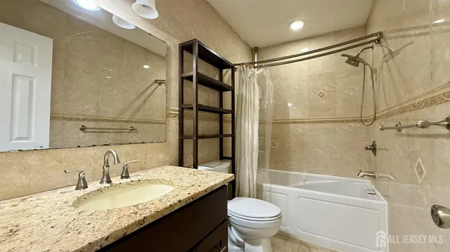 a view of a room with wooden floor and a window