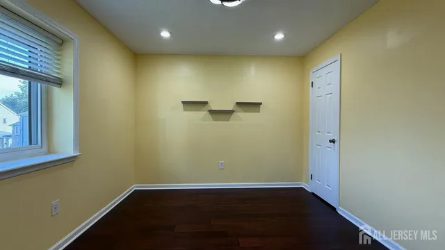 a living room with furniture and gym equipment