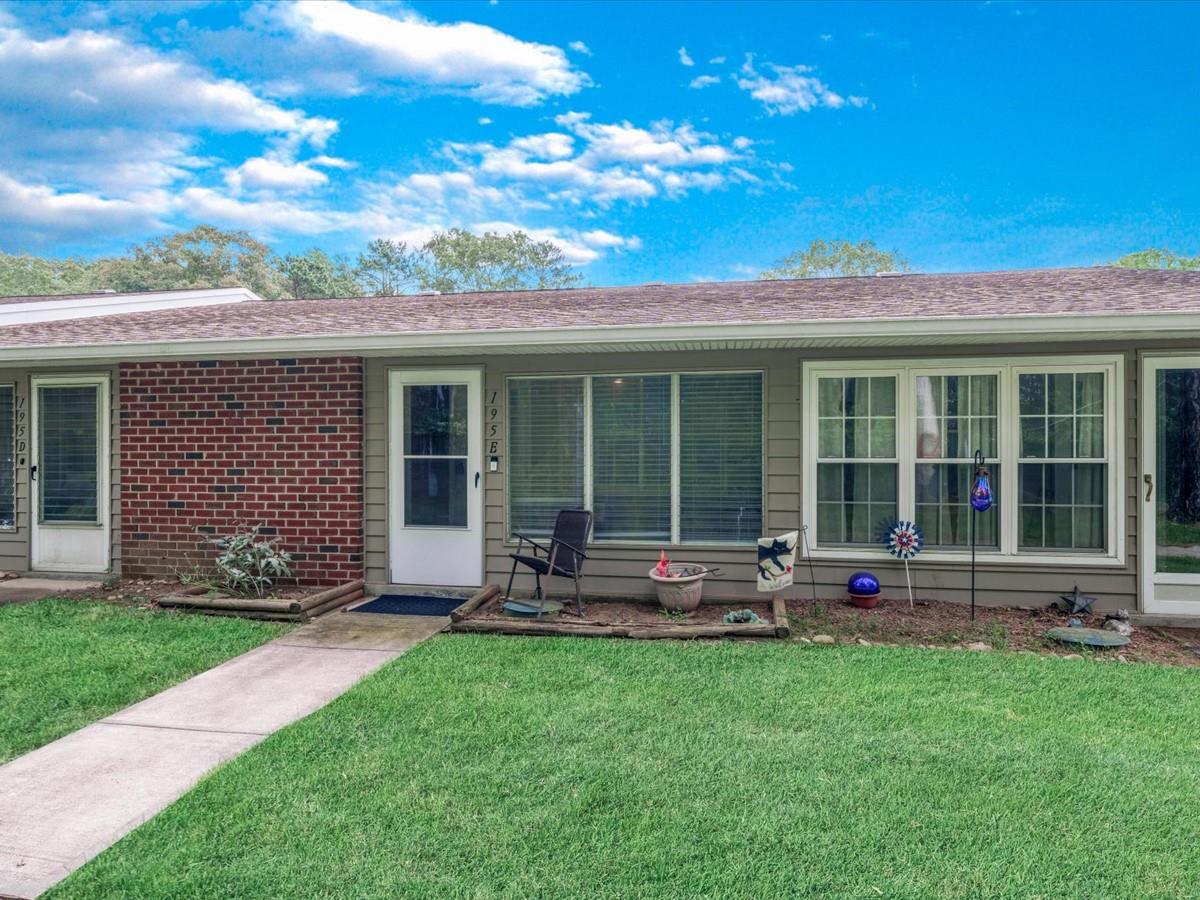 a house view with a garden space