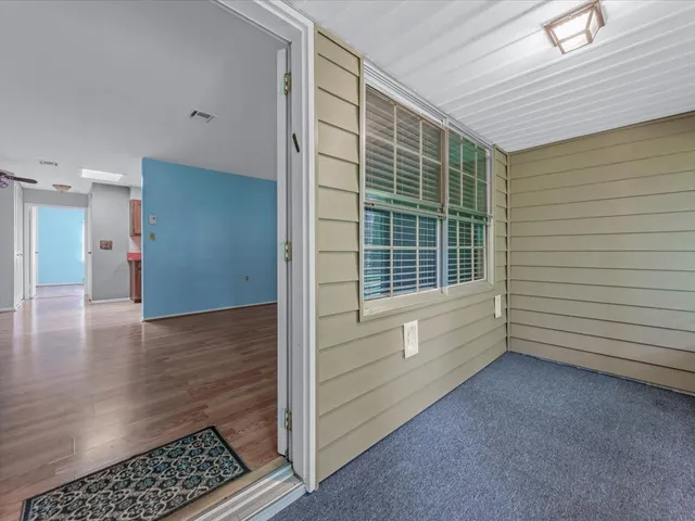 a view of an empty room with a window