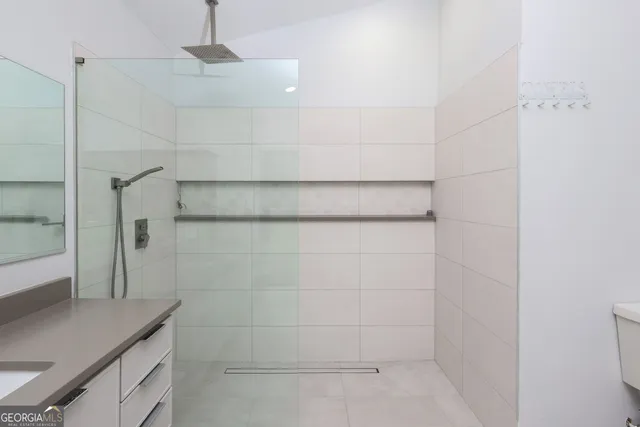 a bathroom with a bathtub and shower