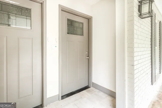 a view of a bedroom from a corridor