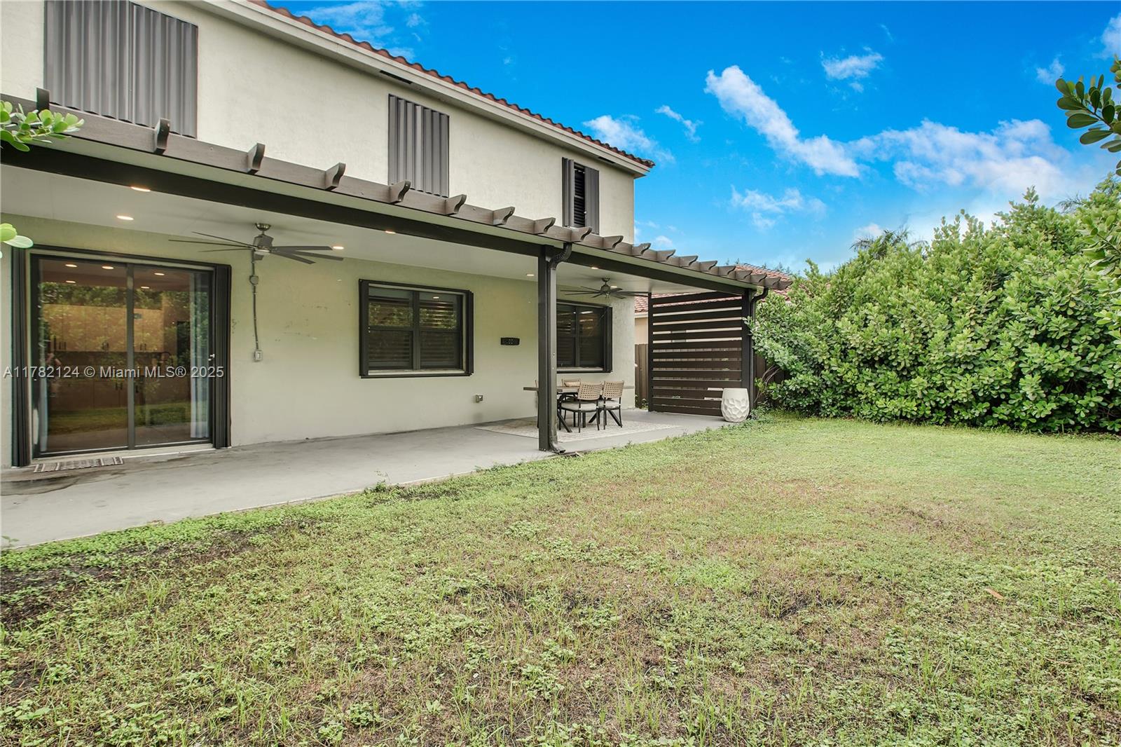 15451 Southwest 173rd Lane Miami, FL 33187 - Photo 15 of 17 a front view of a house with a yard