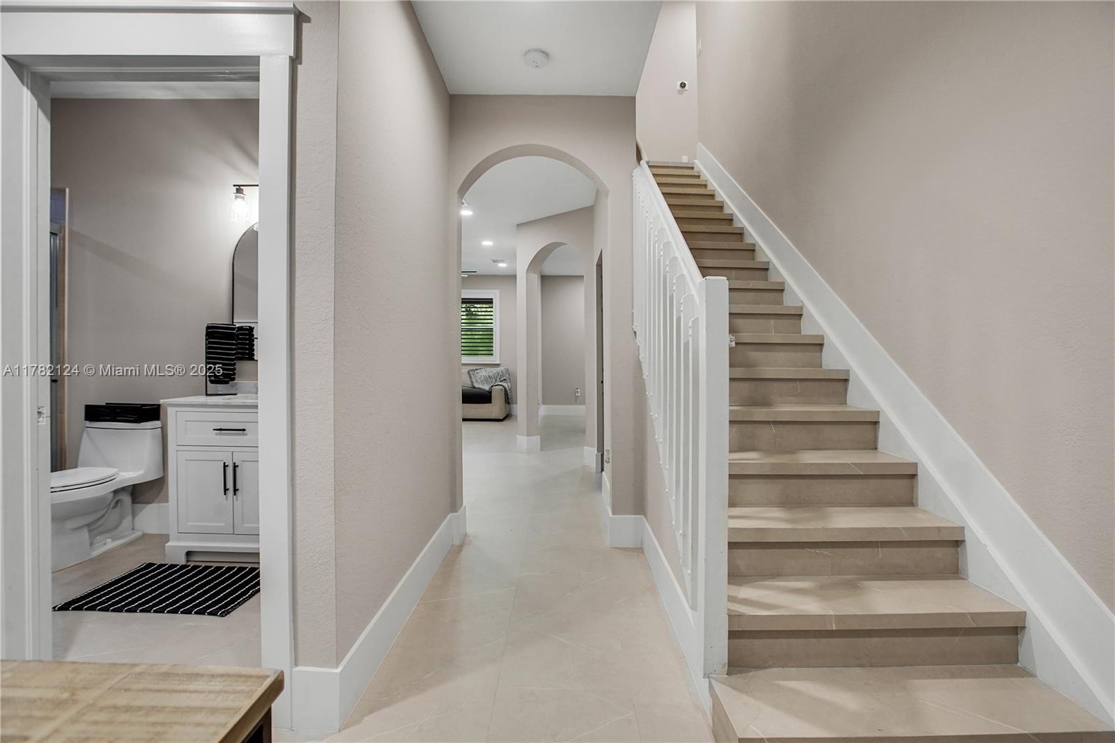 15451 Southwest 173rd Lane Miami, FL 33187 - Photo 2 of 17 a view of a hallway with wooden floor and entryway