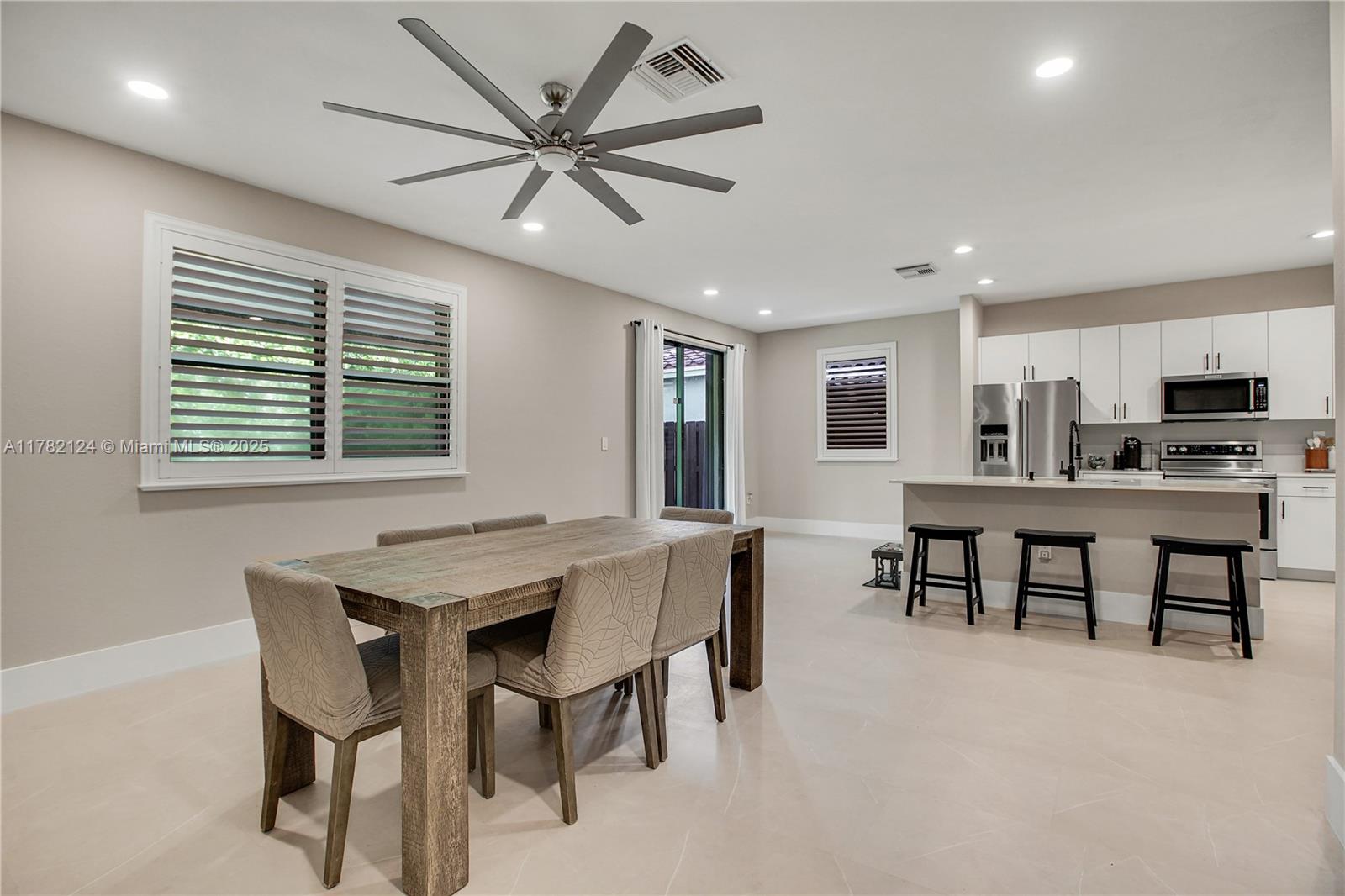 15451 Southwest 173rd Lane Miami, FL 33187 - Photo 4 of 17 a view of a dining room with furniture