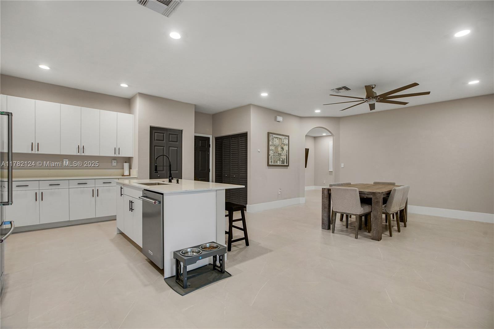 15451 Southwest 173rd Lane Miami, FL 33187 - Photo 6 of 17 a view of a kitchen with furniture and a window