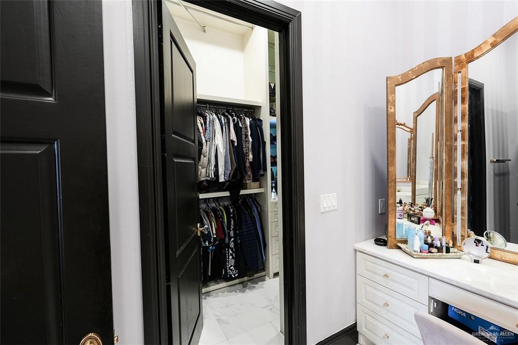 1107 Union Court Mission, TX 78572 - Photo 11 of 21 a view of walk in closet with clothes and shoes