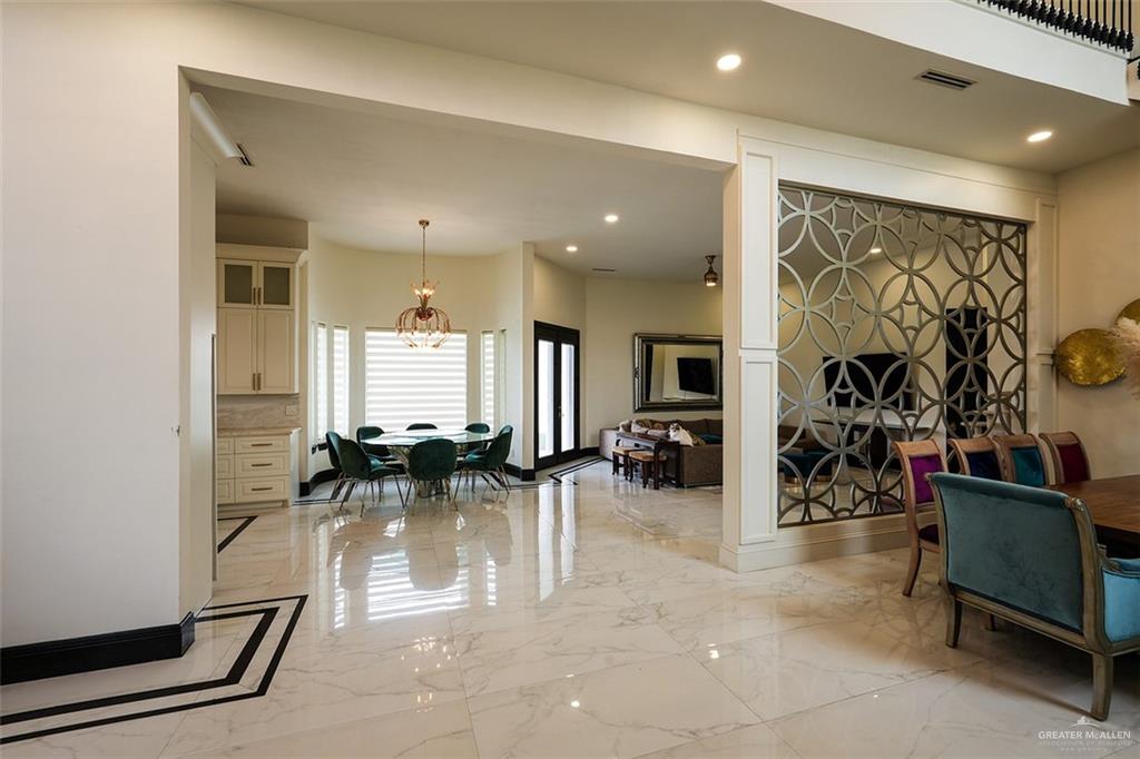 1107 Union Court Mission, TX 78572 - Photo 4 of 21 a room with lots of chairs and mirrors