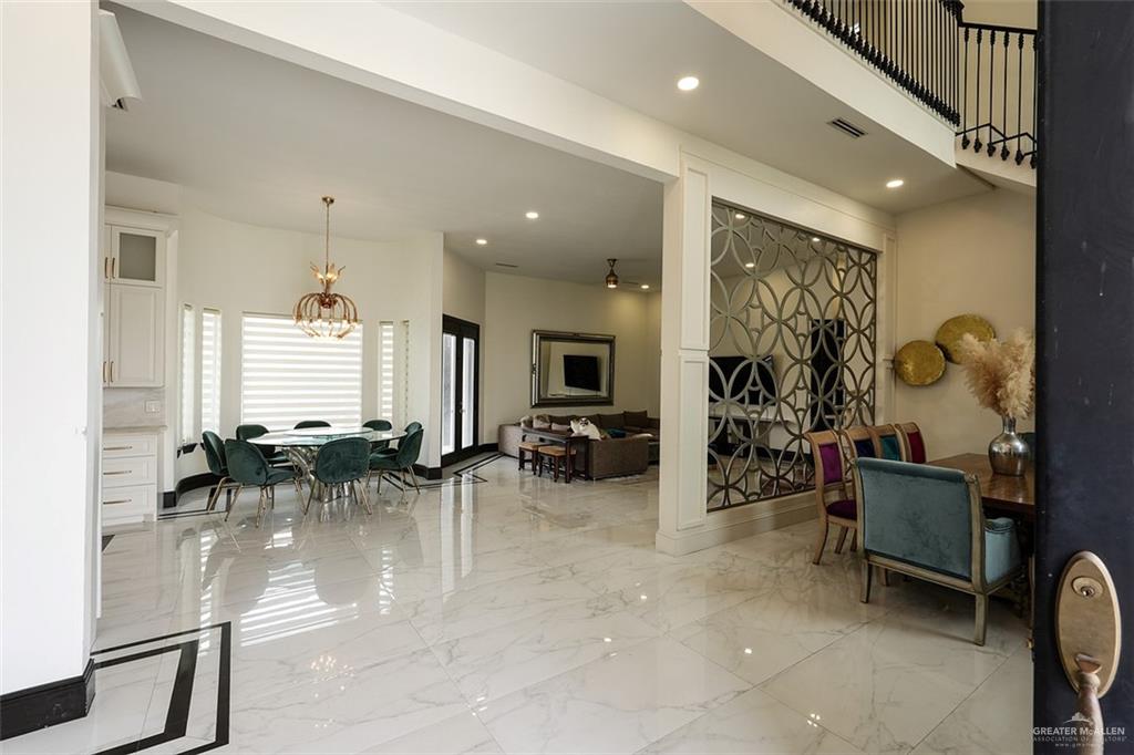 1107 Union Court Mission, TX 78572 - Photo 5 of 21 a room with lots of chairs and mirrors