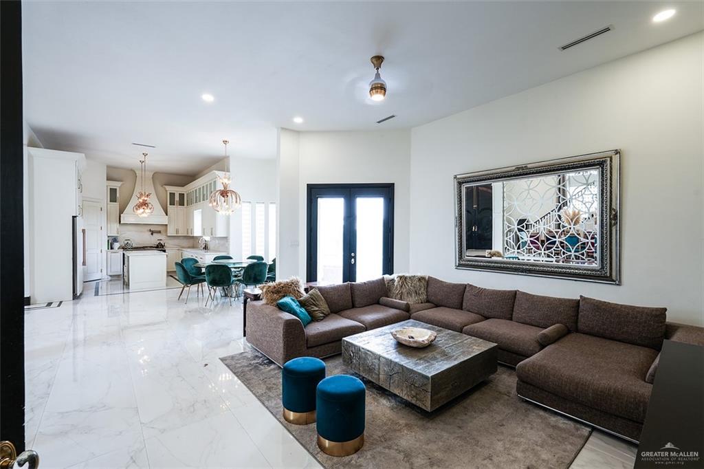 1107 Union Court Mission, TX 78572 - Photo 8 of 21 a living room with furniture ceiling fan and a rug