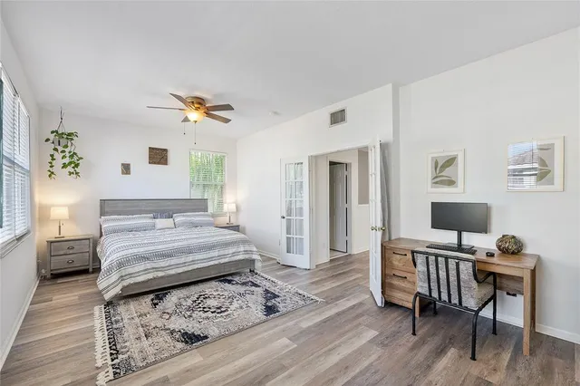 a bedroom with a bed and a desk