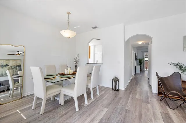 a view of a dining room with furniture and wooden floor