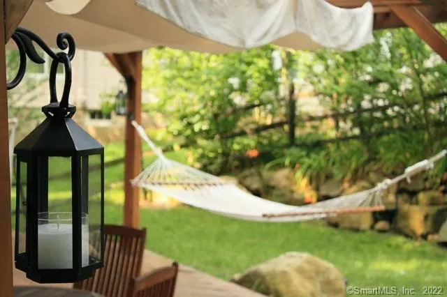 a view of a backyard with plants and a patio