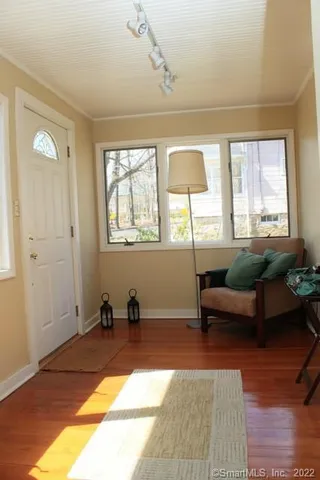a living room with furniture and a window
