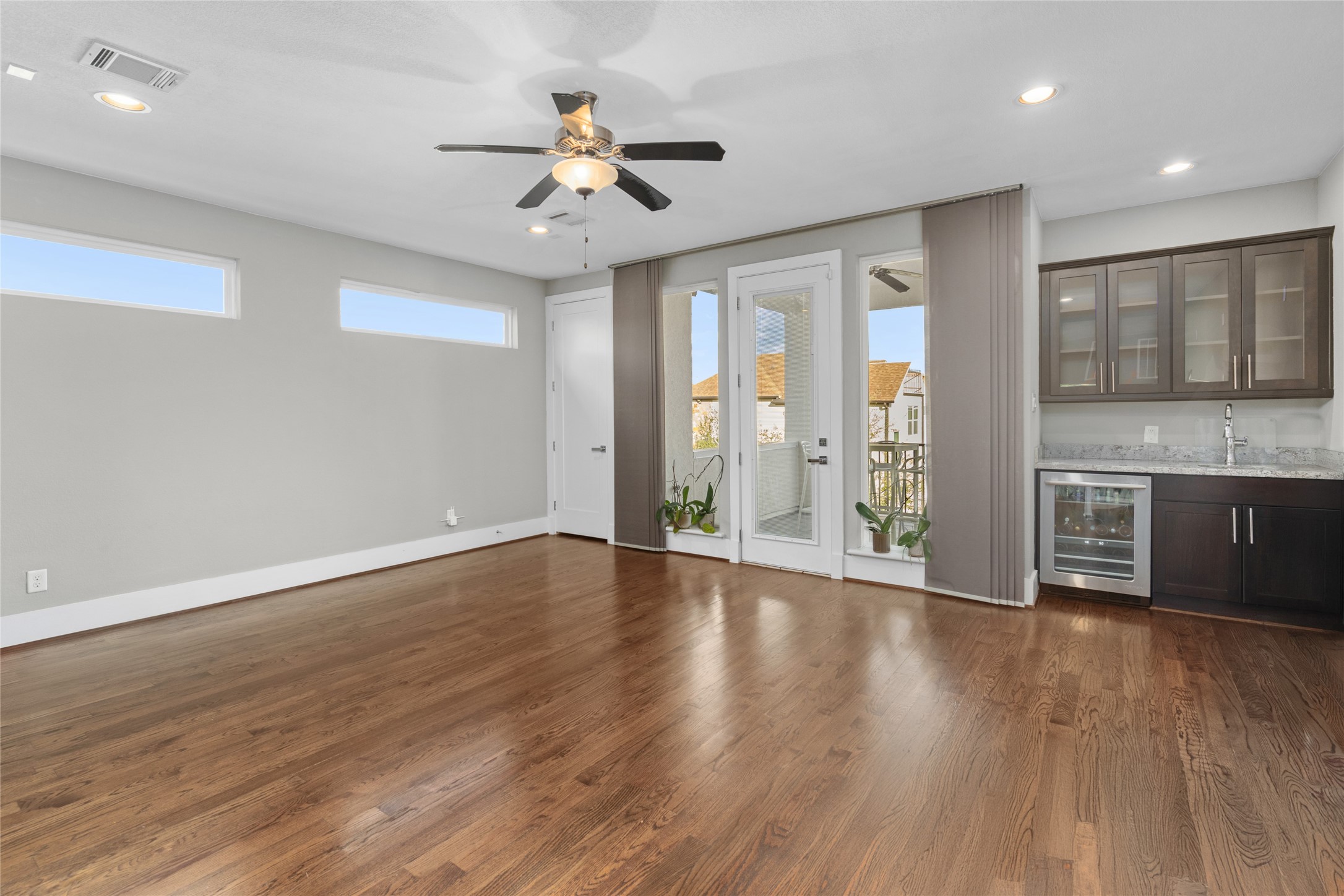 1605 Knox Street, Unit B Houston, TX 77007 - Photo 24 of 28 a view of an empty room with a window and wooden floor