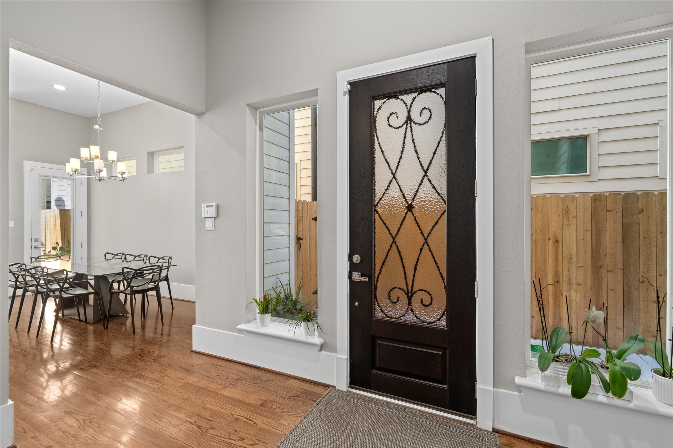 1605 Knox Street, Unit B Houston, TX 77007 - Photo 4 of 28 a view of a entryway door dining room and hall with wooden floor