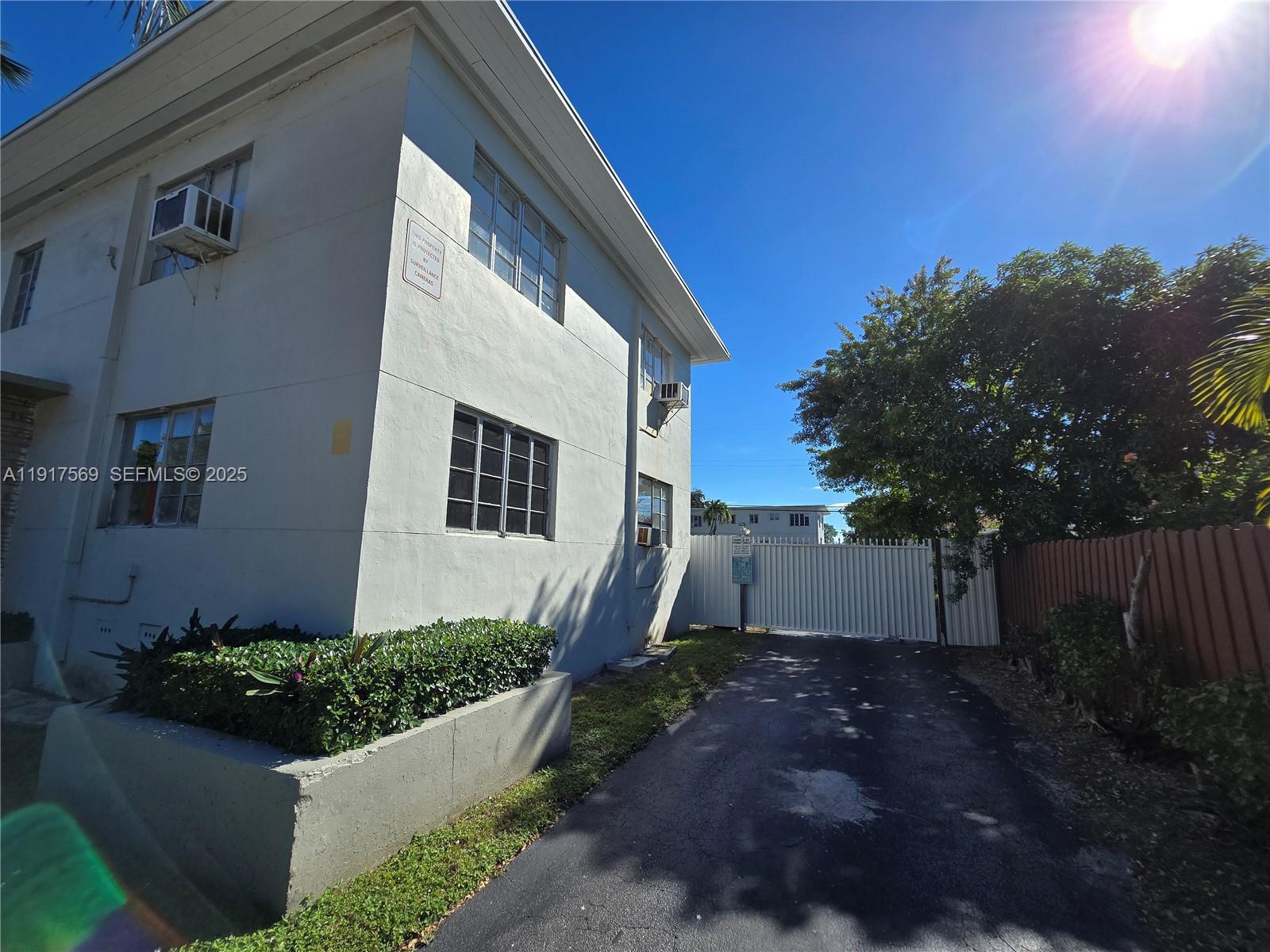 660 84th Street, Unit 39 Miami Beach, FL 33141 - Photo 15 of 17 a view of a back yard of the house