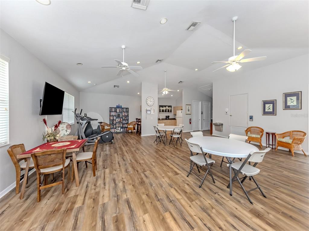 205 Reclinata Circle Venice, FL 34292 - Photo 36 of 62 a view of a dining room with furniture wooden floor and a chandelier