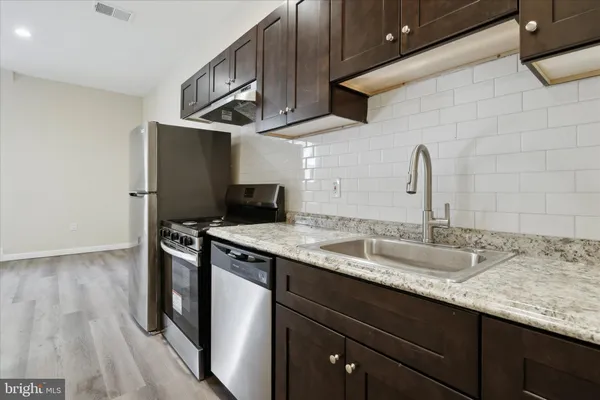 a bathroom with a sink and a bathtub