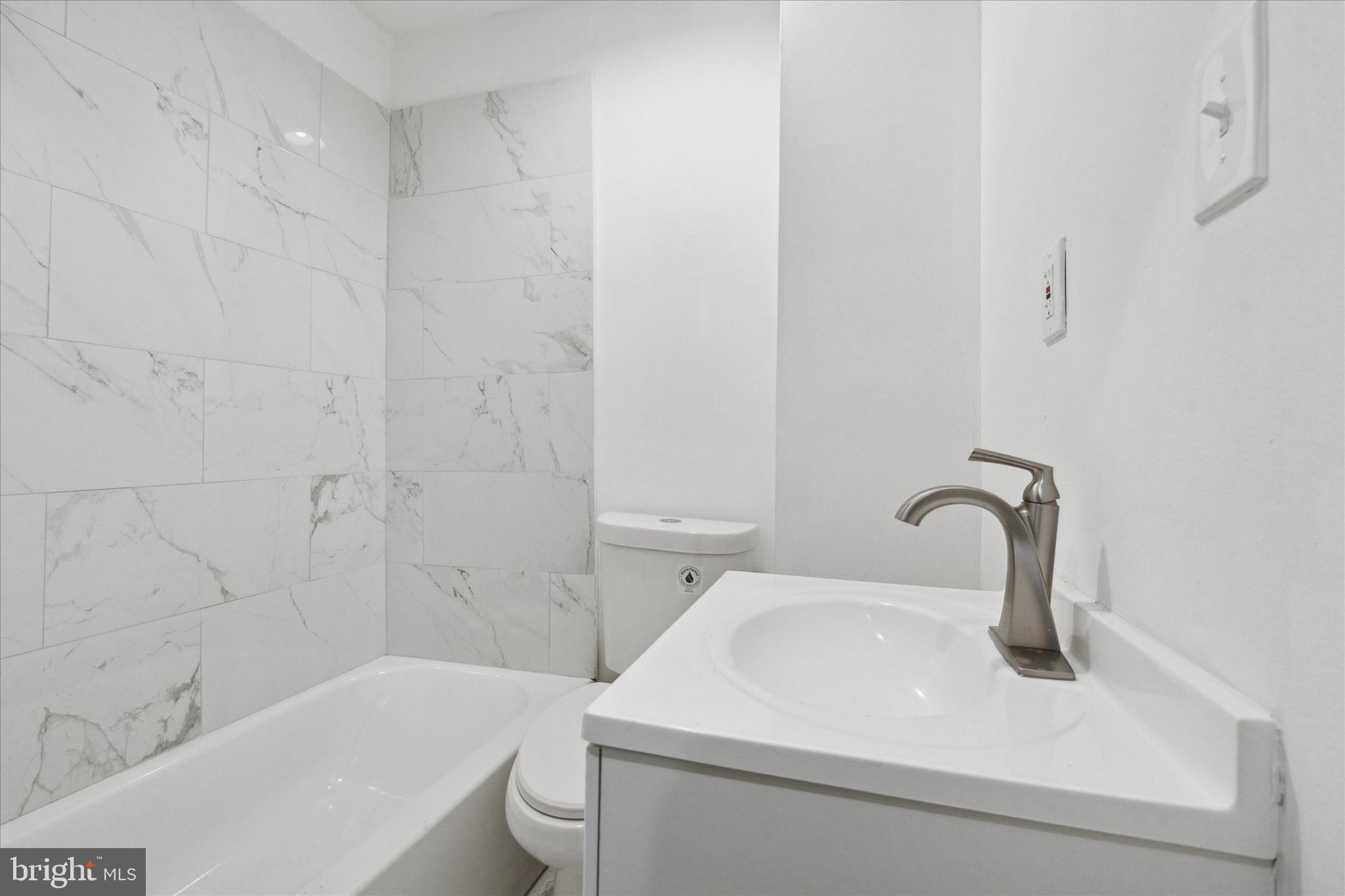 1501 Reed Street Philadelphia, PA 19146 - Photo 6 of 17 a bathroom with a sink and a bathtub
